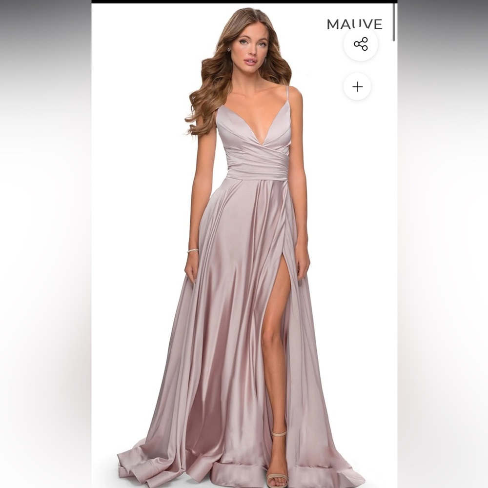 Selling this beautiful satin dress in size 4. New with tags.